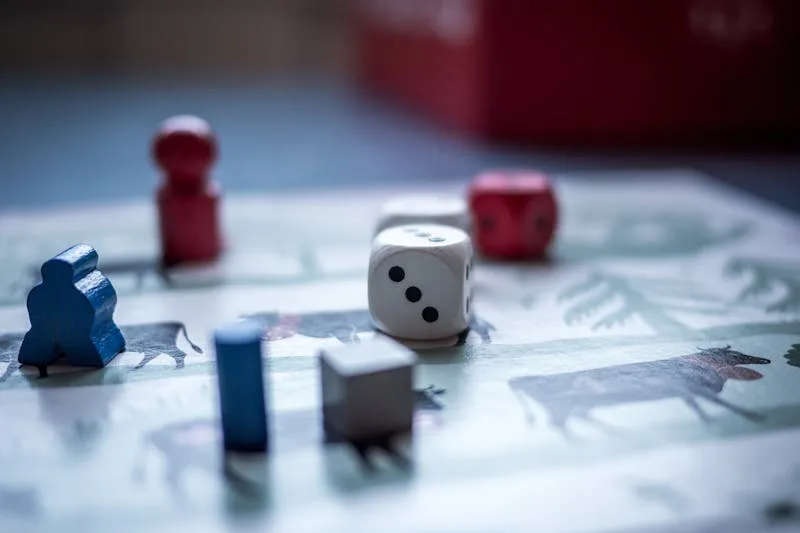 Close-up of dice on a gaming tabletop with game cards nearby